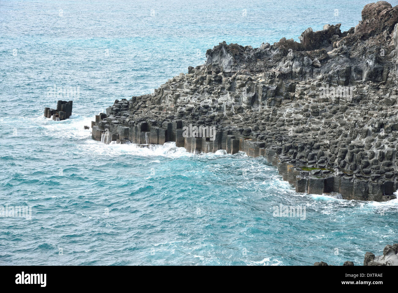 basaltic columnar joint coast in JungMun in Jeju Island Stock Photo