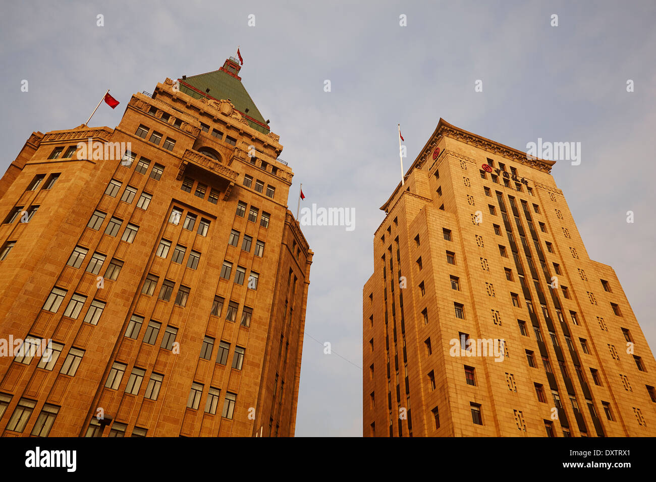 Bank of China Building (right) and the Peace Hotel, two historical iconic buildings on the riverside Bund, beside the Huangpu River, Shanghai, China. Stock Photo