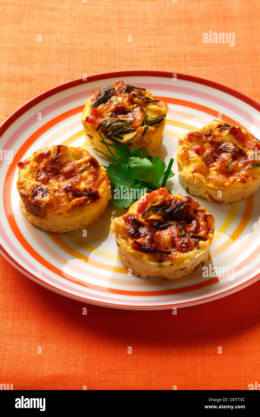 Apple,bacon and herb mini flans Stock Photo