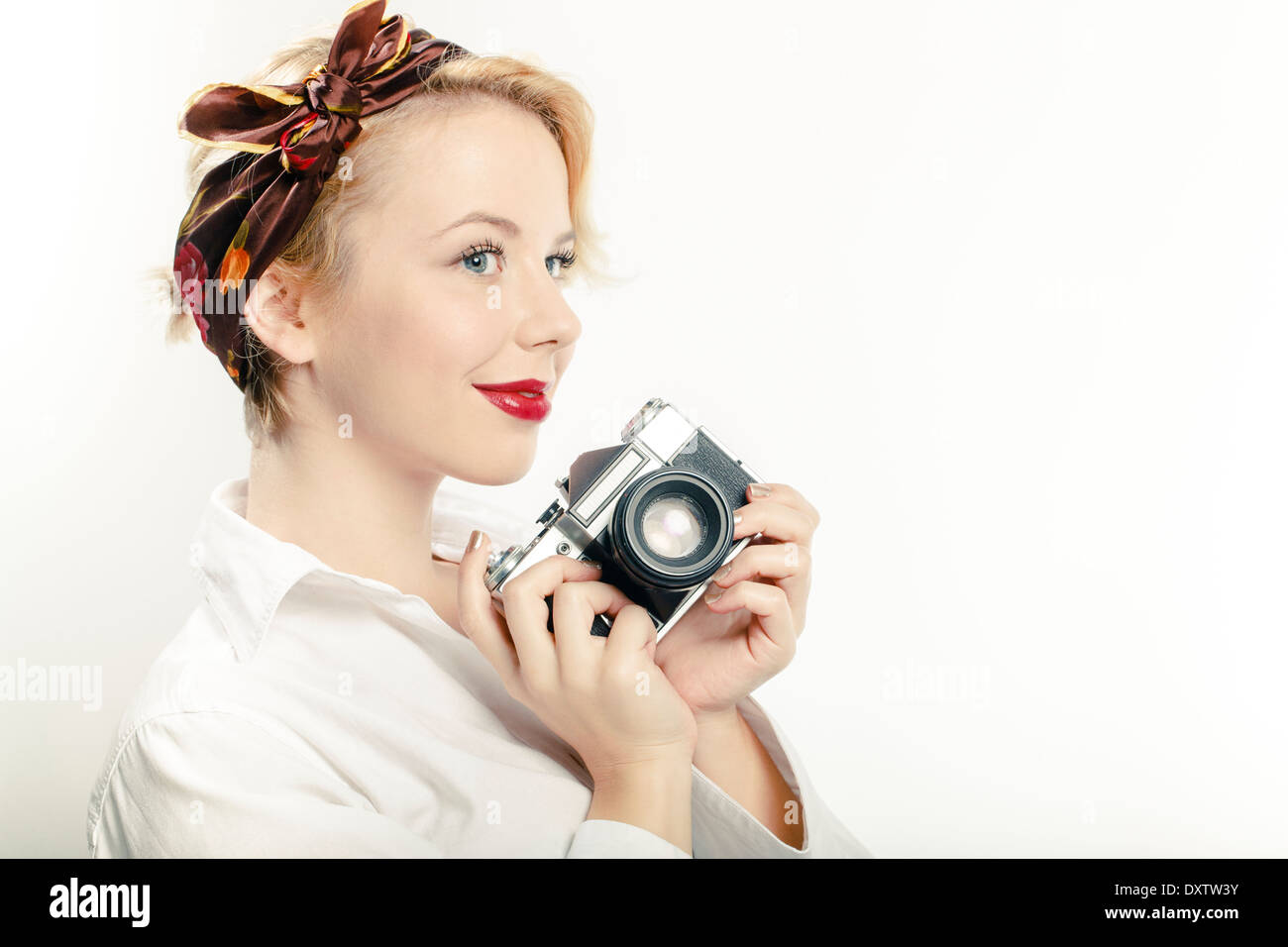 Young Woman Using Photo Camera, Portrait Stock Photo