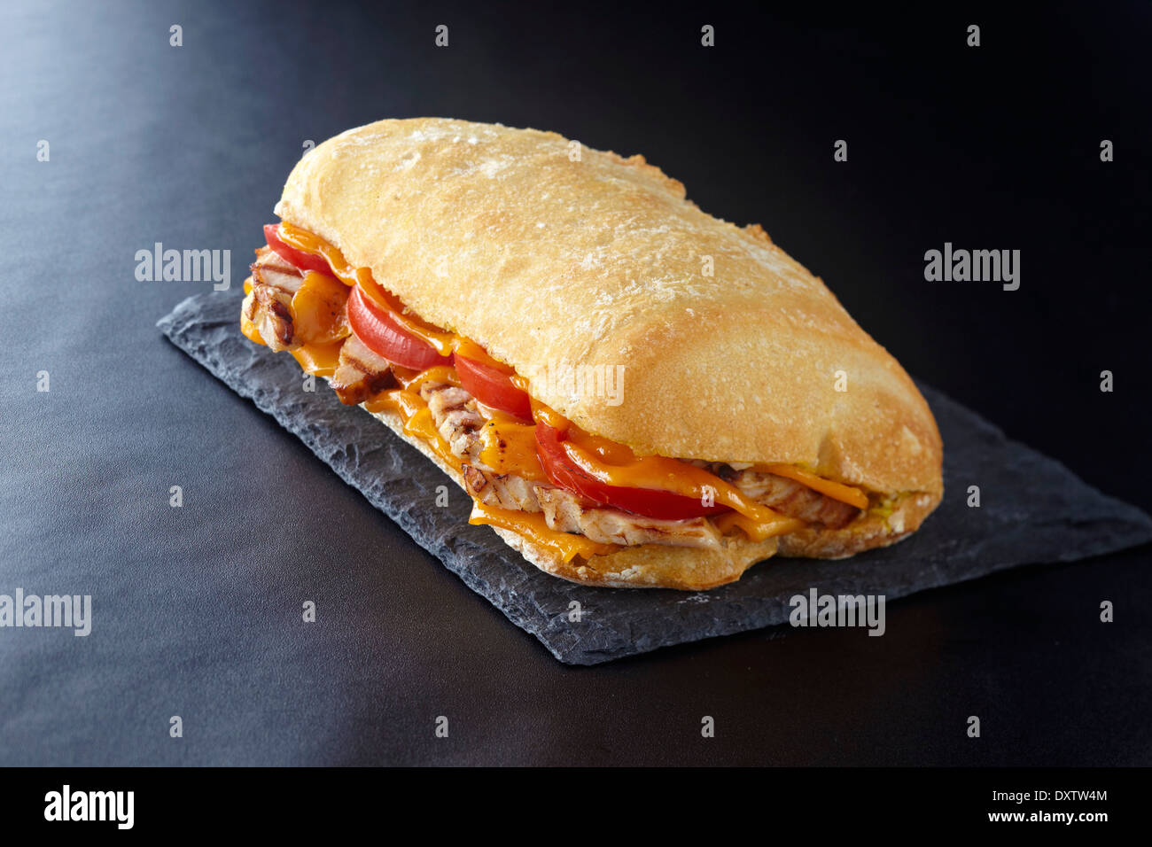 Chicken,cheddar and tomato bread sandwich Stock Photo