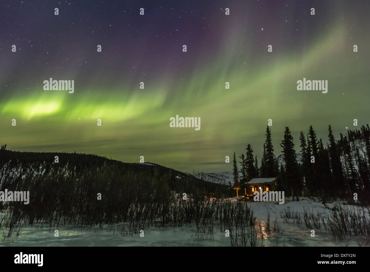 Aurora Borealis Swirls Over Windy Gap Cabin In The White Mountains