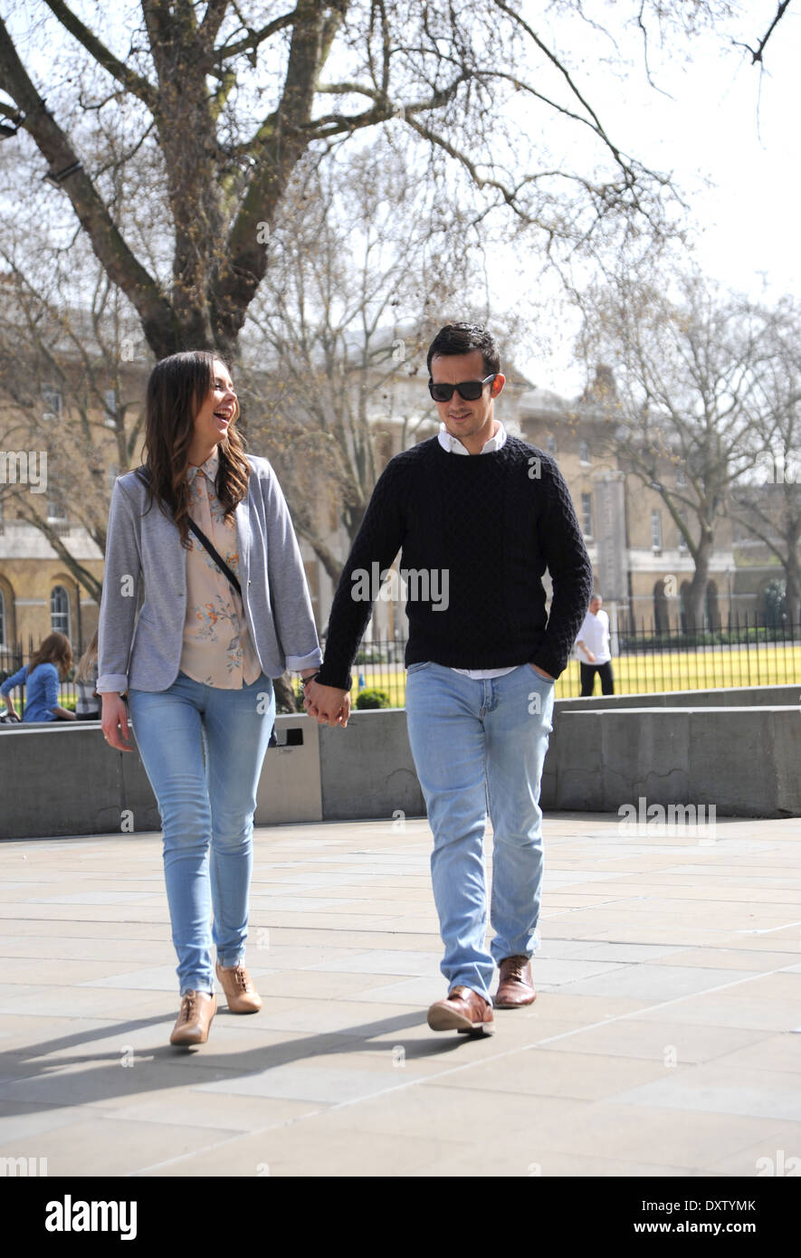 Young couple walking hand in hand hi-res stock photography and images ...