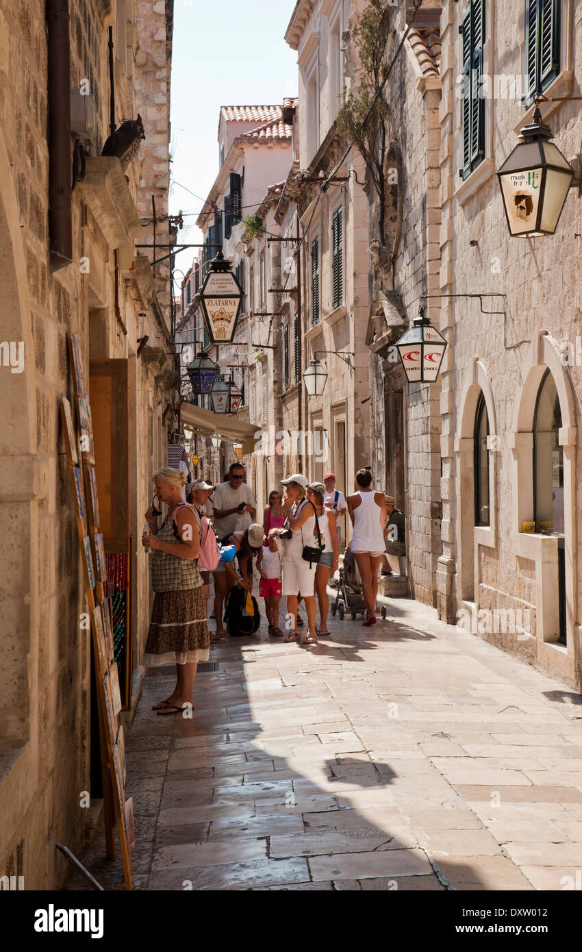 A narrow street in Dubrovnik, Croatia filled with tourist Stock Photo