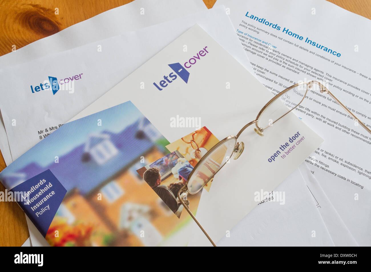 UK Landlord's household insurance documents - Landlords' expenses concept Stock Photo