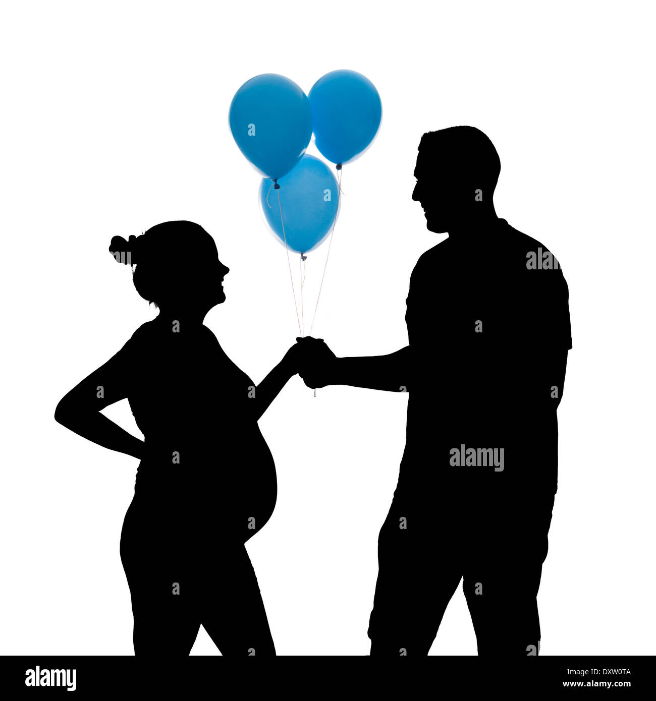 Silhouette of a happy pregnant couple on a white background Stock Photo