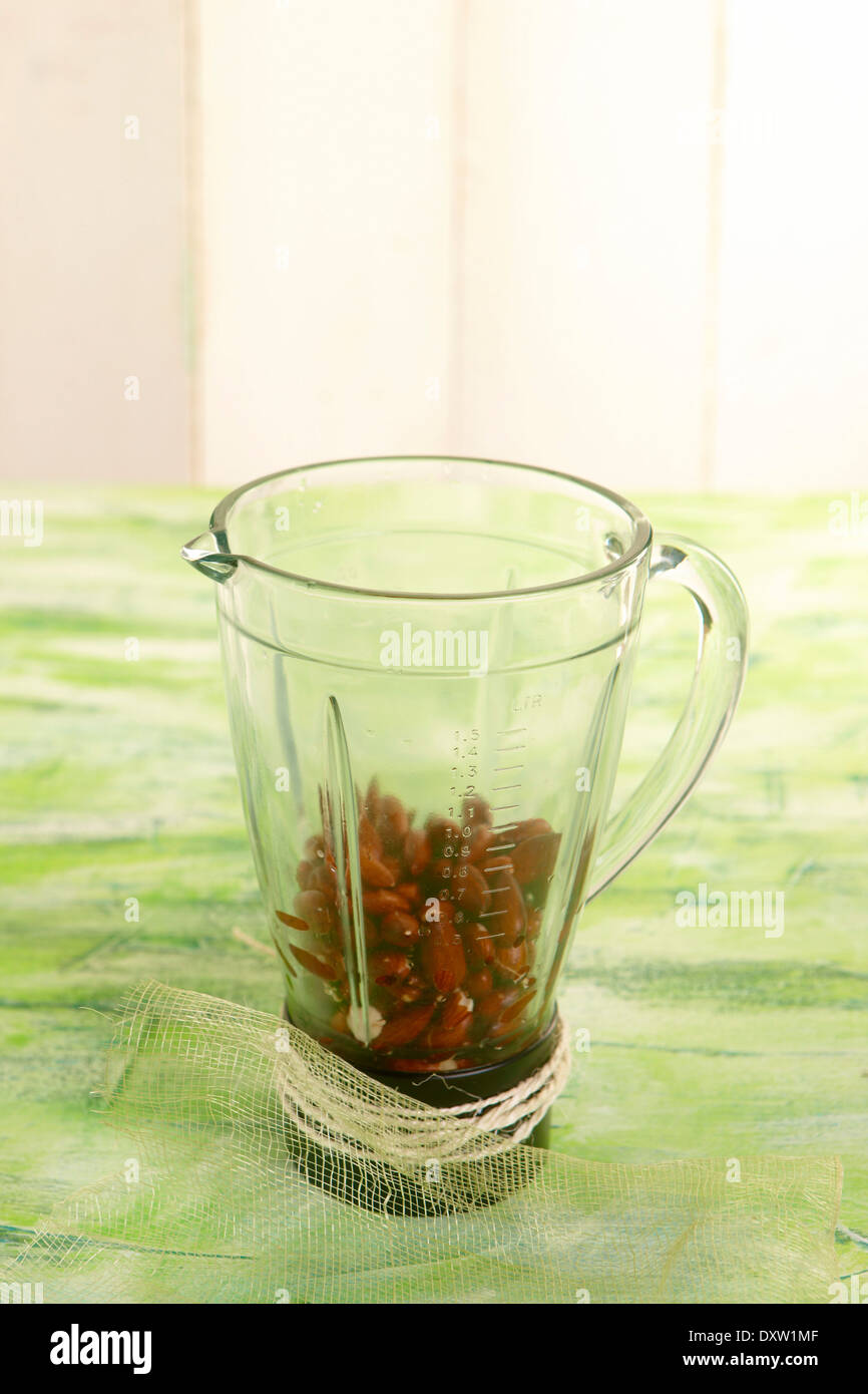 Putting the almonds in a blender Stock Photo Alamy