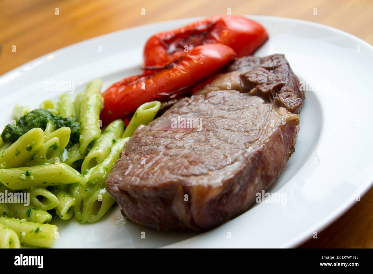 Steak with ramson pasta and pepper Stock Photo