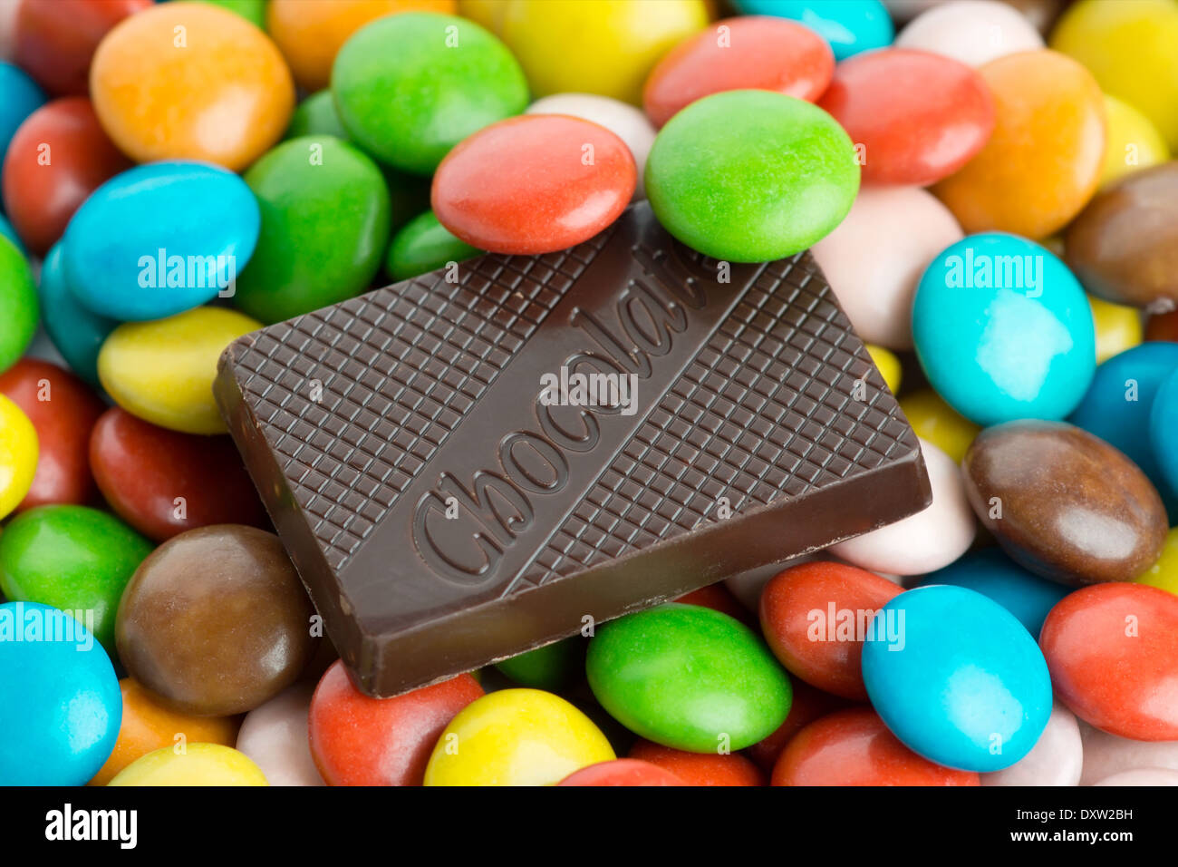 Chocolate bar and colorful candies Stock Photo