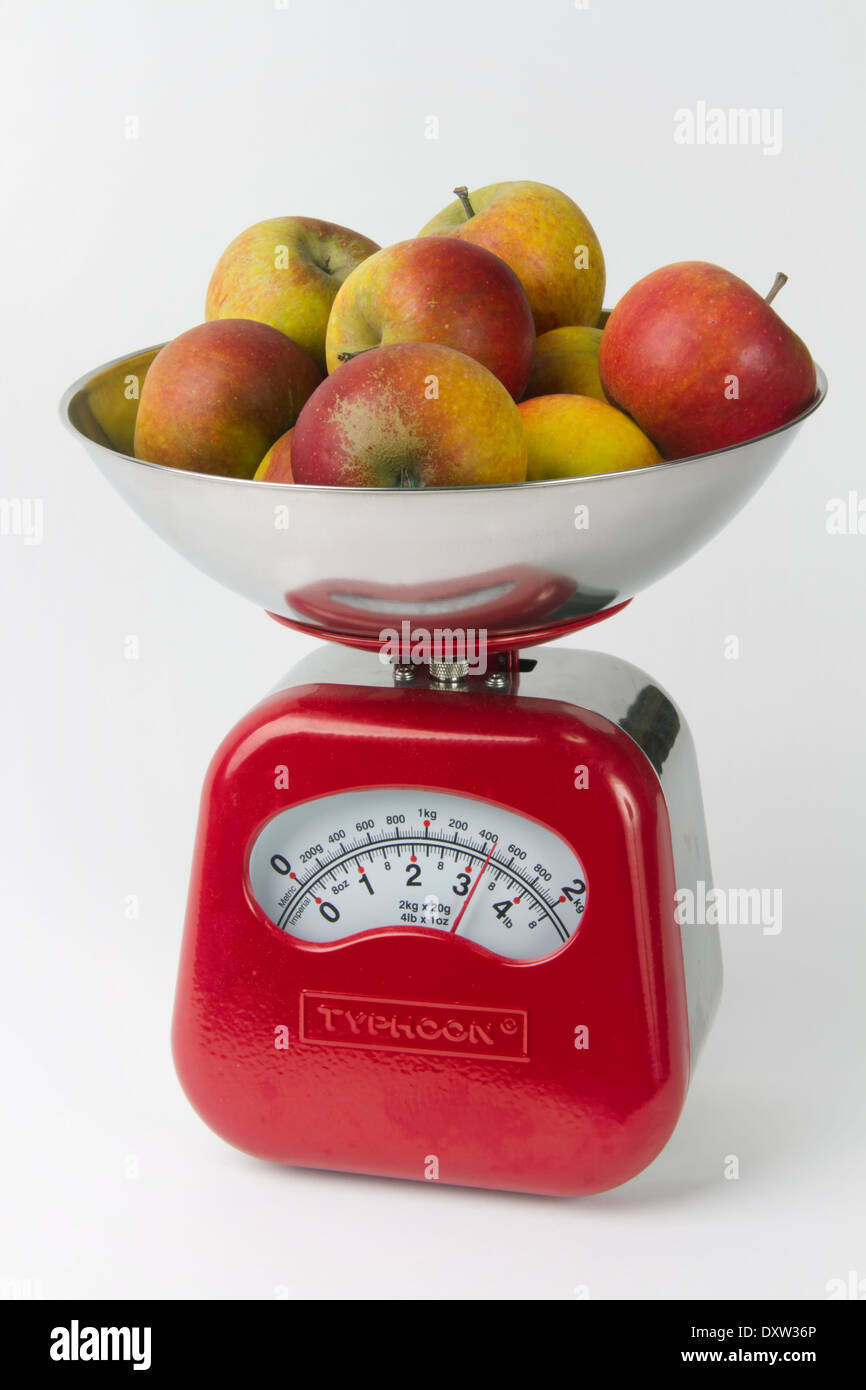 Three Red Apples On A Food Scale On A White Background Stock Photo, Picture  and Royalty Free Image. Image 6768478.