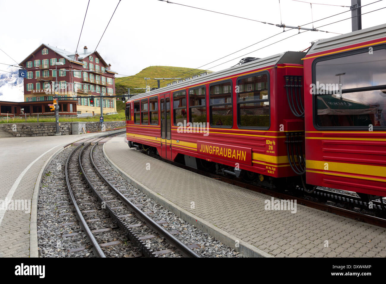 Chalet hotel at train station Kleine Scheidegg red train to Jungfraubahn in Swiss Alps near Grindelwald, Switzerland Stock Photo