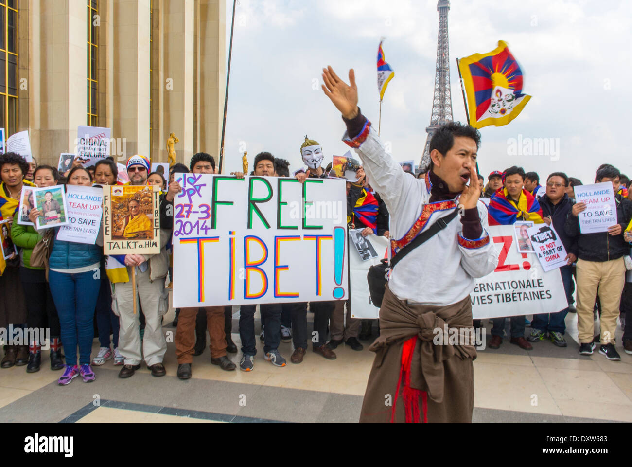 Crowd of Tibetan, Taiwanese, Ethnic Communities of France, Migrants and Friends called for French citizens to mobilize during the visit of Chinese President in Paris, Holding Protest signs Stock Photo