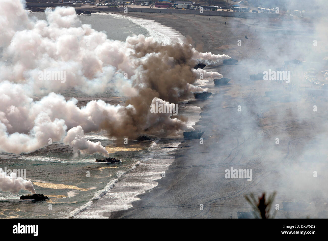 South Korean Marines amphibious assault vehicles approach the beach during a simulated amphibious assault part of joint training exercise Ssang Yong March 31, 2014 in Doksu-Ri, Pohang, South Korea. Stock Photo