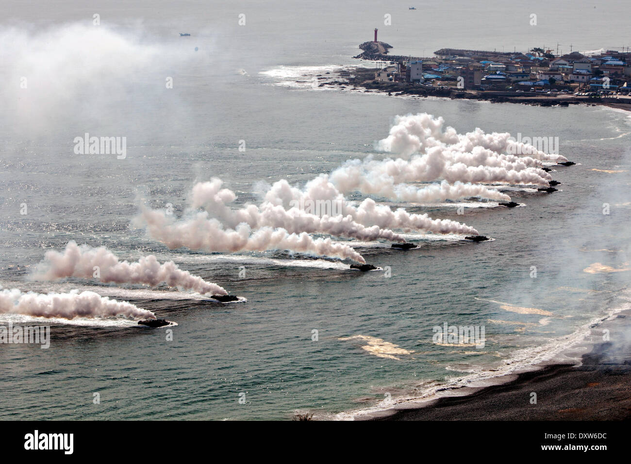 South Korean Marines amphibious assault vehicles approach the beach during a simulated amphibious assault part of joint training exercise Ssang Yong March 31, 2014 in Doksu-Ri, Pohang, South Korea. Stock Photo