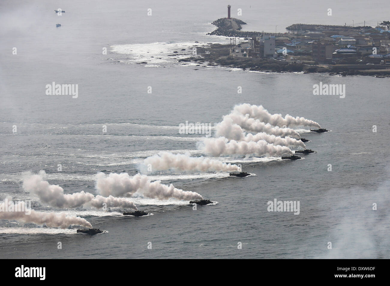 South Korean Marines amphibious assault vehicles approach the beach during a simulated amphibious assault part of joint training exercise Ssang Yong March 31, 2014 in Doksu-Ri, Pohang, South Korea. Stock Photo