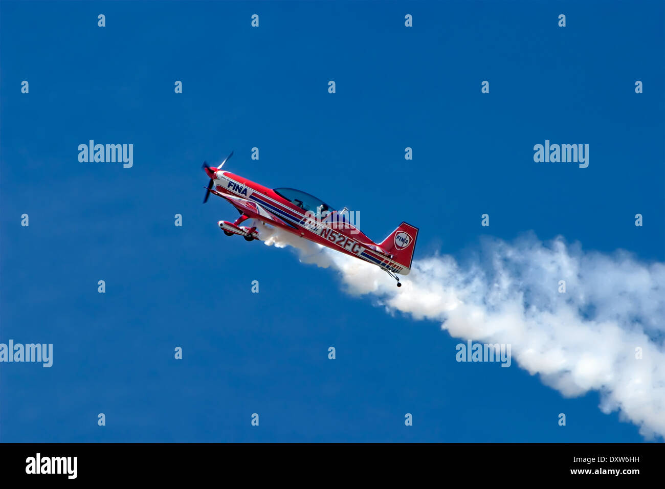 Airshow with Extra EA-300L Climbing Fast in Altitide Stock Photo