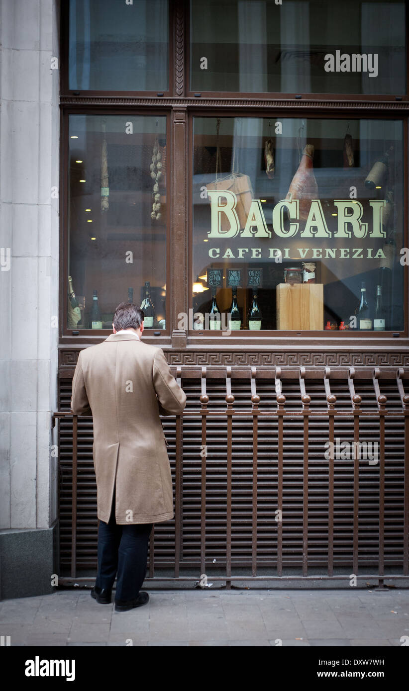 Businessman outside Italian cafe Stock Photo
