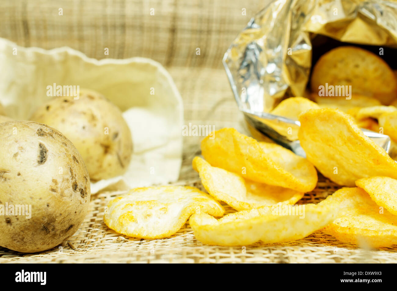 Natural potato chips in a package and potatoes in the bag Stock Photo ...