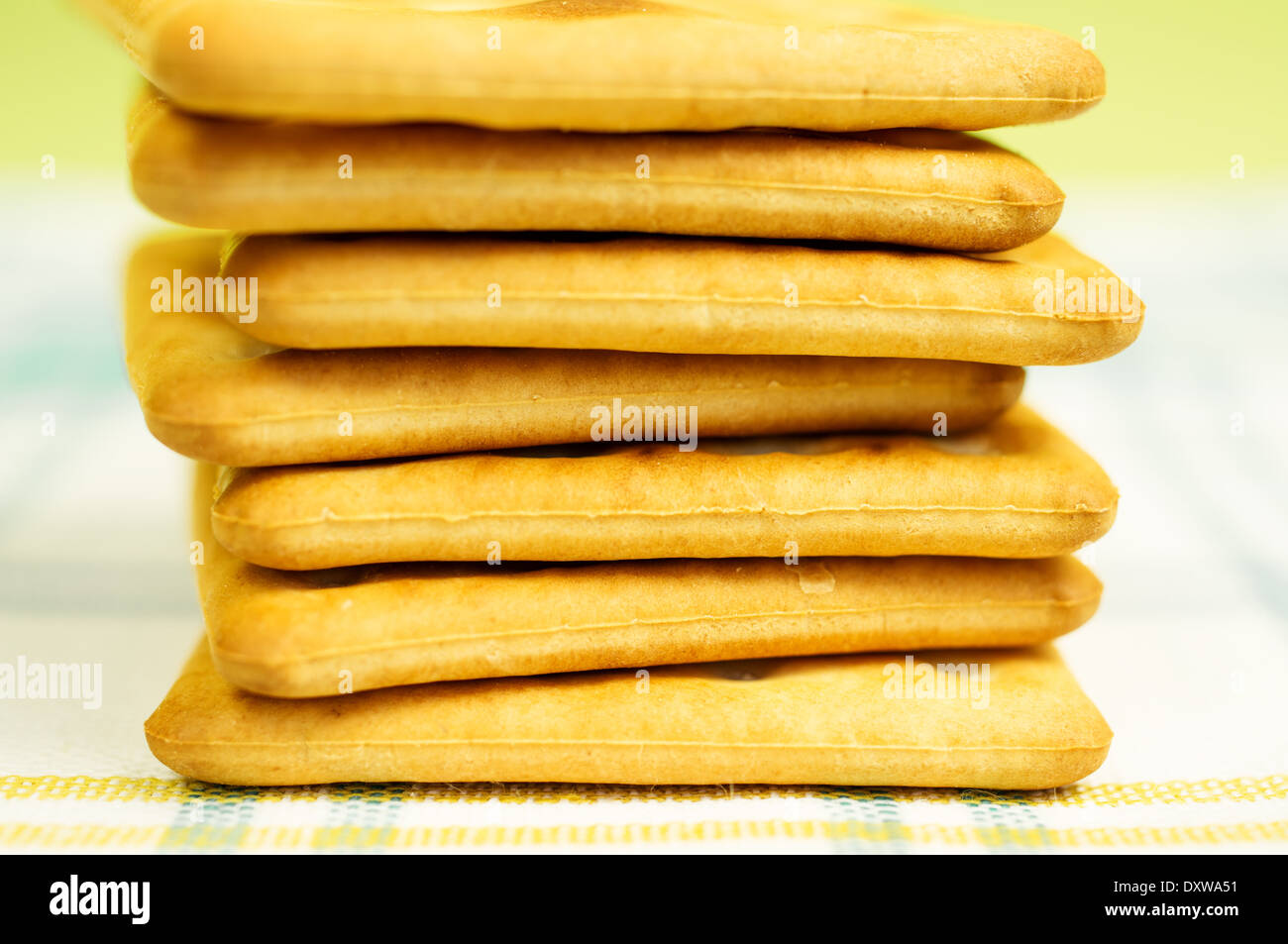 Stack of crackers on the table cloth. Stock Photo