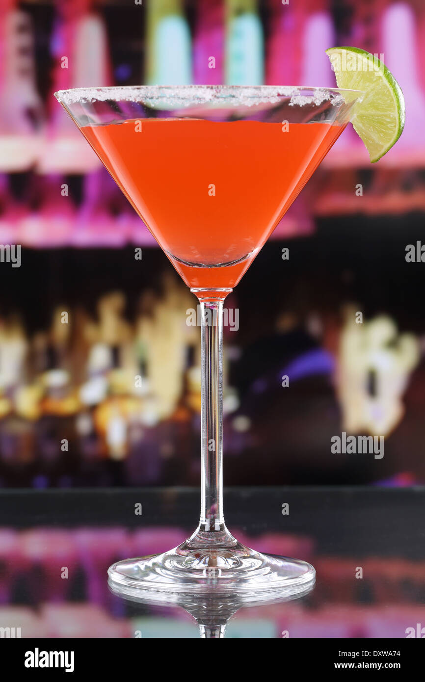 Red Martini Cocktail in a glass in a bar or a party Stock Photo