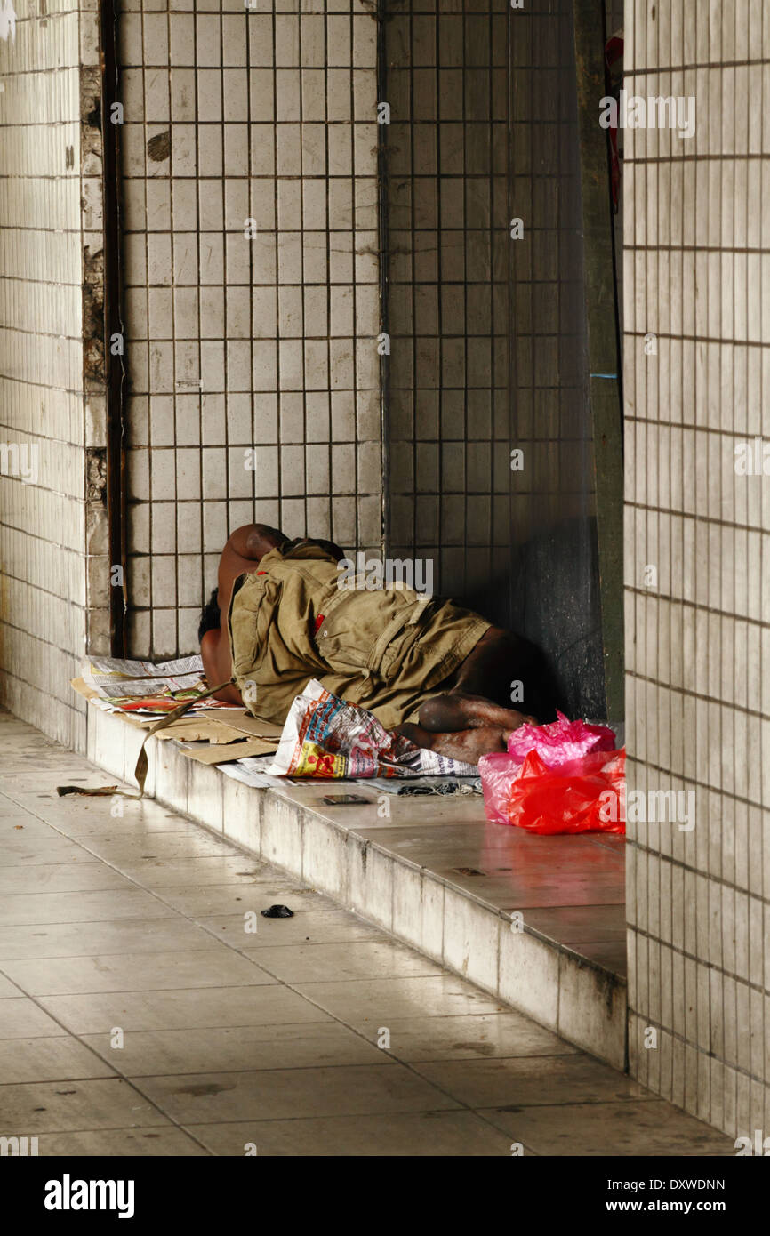 Like every city I have been to, not all have a home, nor a belly full of food. A vagrant on the streets - Kuala Lumpur, Malaysia Stock Photo