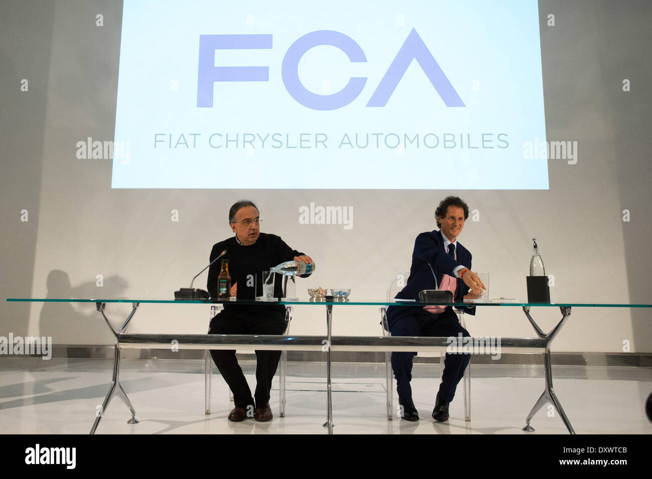 Turin, Italy. 31st Mar, 2014. Sergio Marchionne (L)and John Elkan (R)speak at general Meeting of Fiat Shareholders, in Turin, Italy, on March 31, 2014. This is one of the last meetings before the merge of Fiat and Chrysler in the new company Fiat Chrysler Automobiles. © Mauro Ujetto/NurPhoto/ZUMAPRESS.com/Alamy Live News Stock Photo