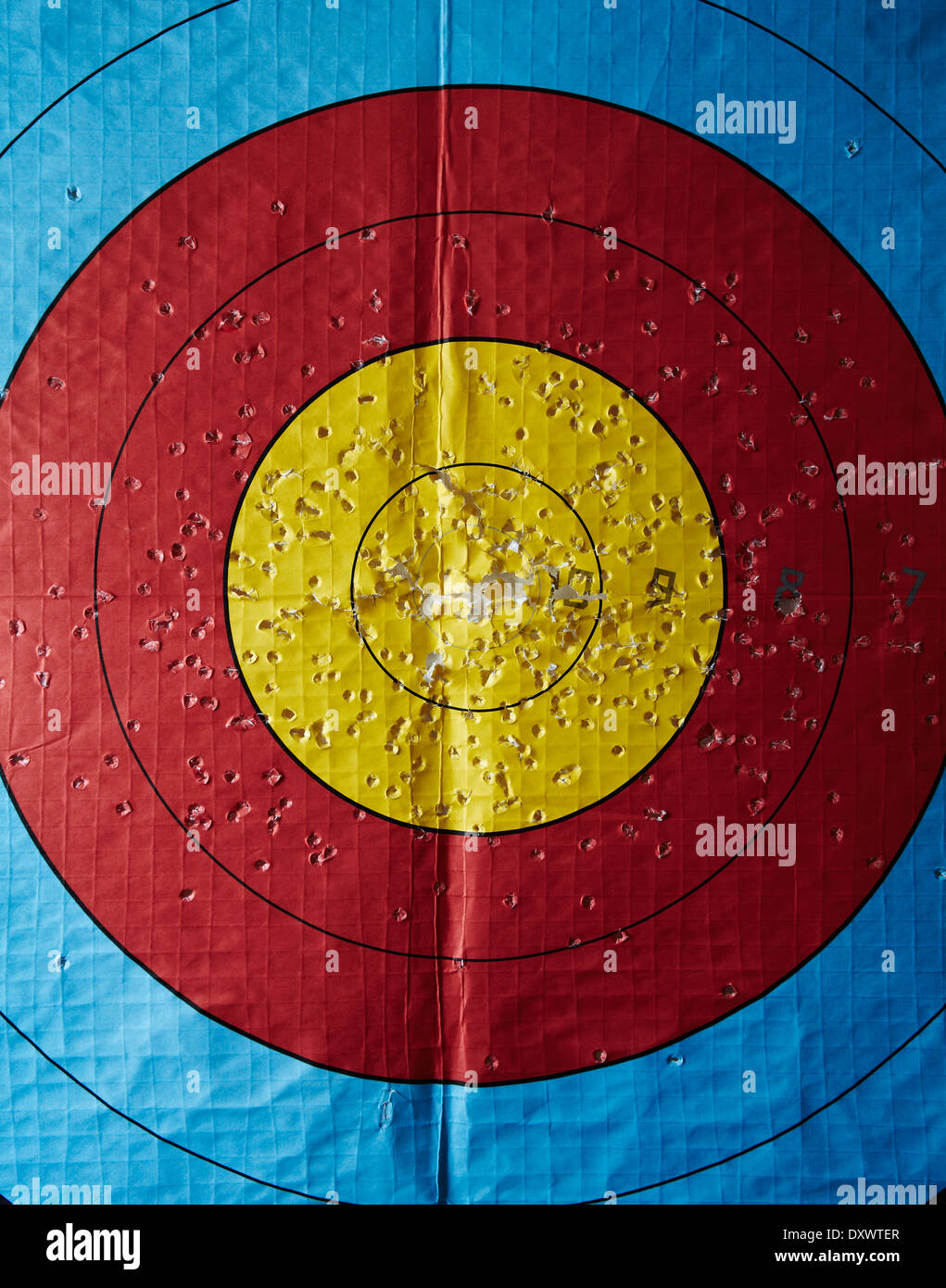 an archery target with lots of holes in it Stock Photo