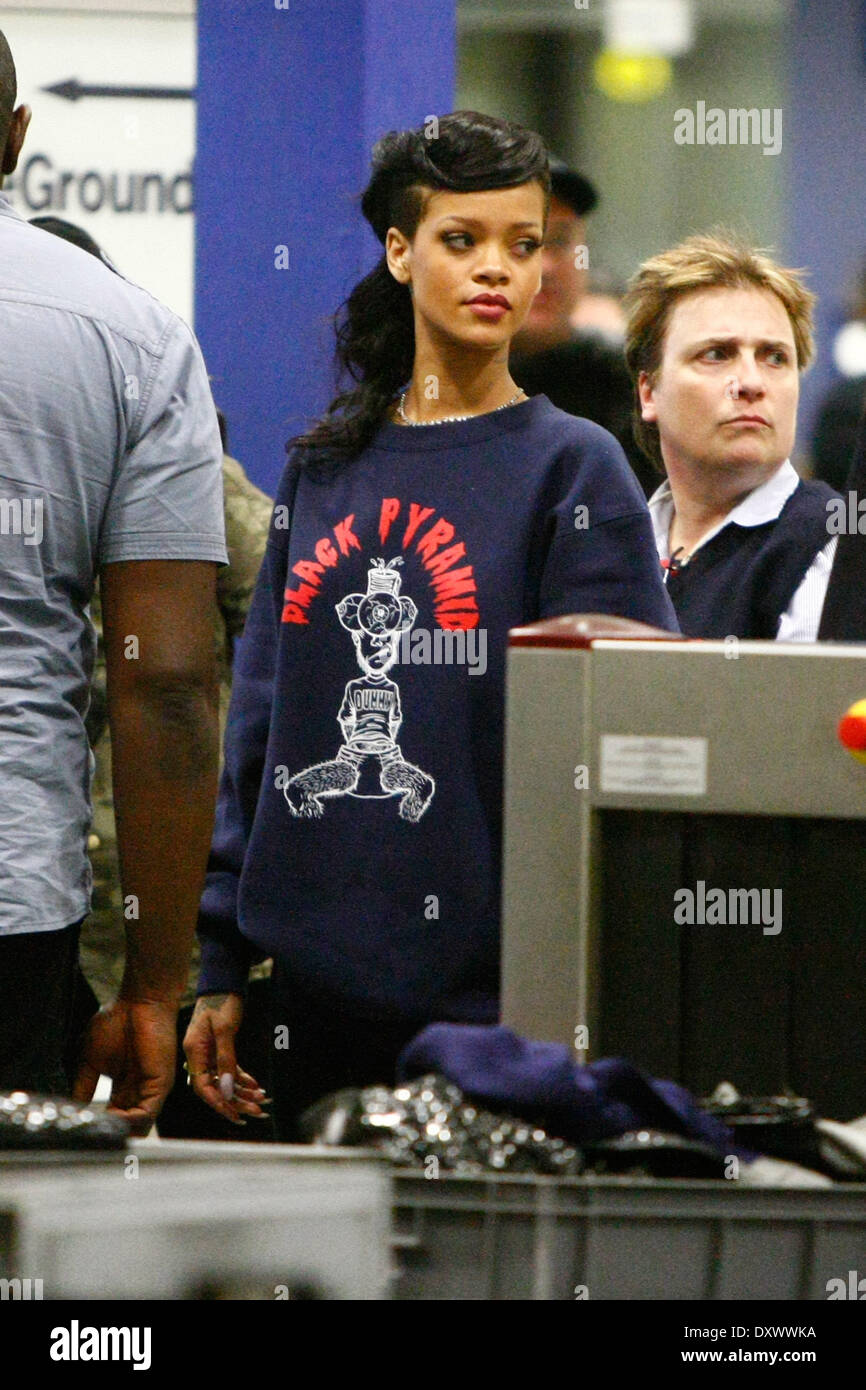 Rihanna at a security check at Schoenefeld airport after the secret concert during her 777 tour. Where: Berlin Germany When: 19 Nov 2012 Stock Photo