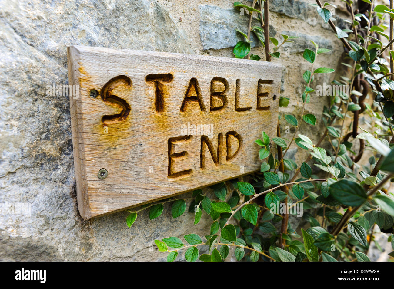 'Stable End' written on a wooden plaque, on a stone wall Stock Photo ...