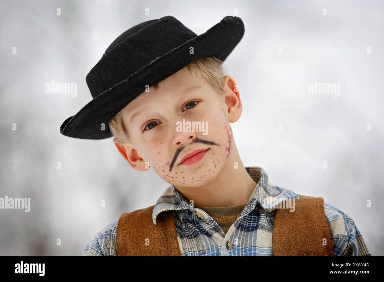 Boy dressed as a cowboy during carnival, portrait Stock Photo - Alamy