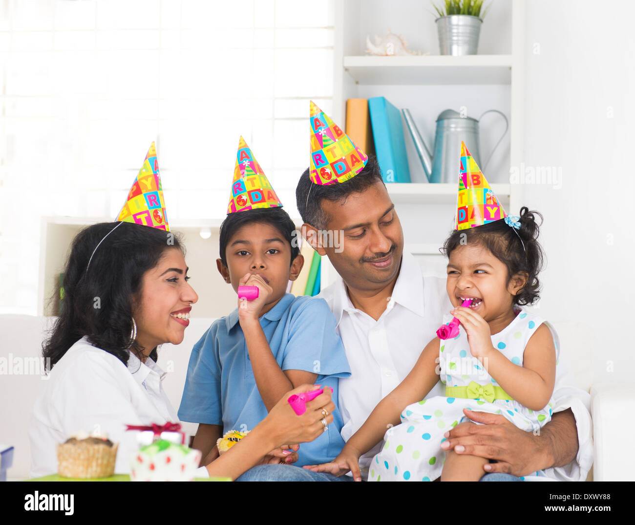 indian family birthday celebration with son and daughter Stock Photo