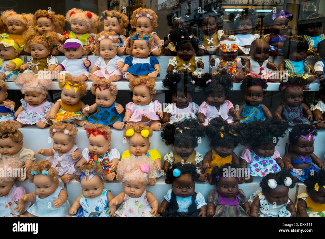 Plastic toy dolls in a Spanish shop window are segregated according to