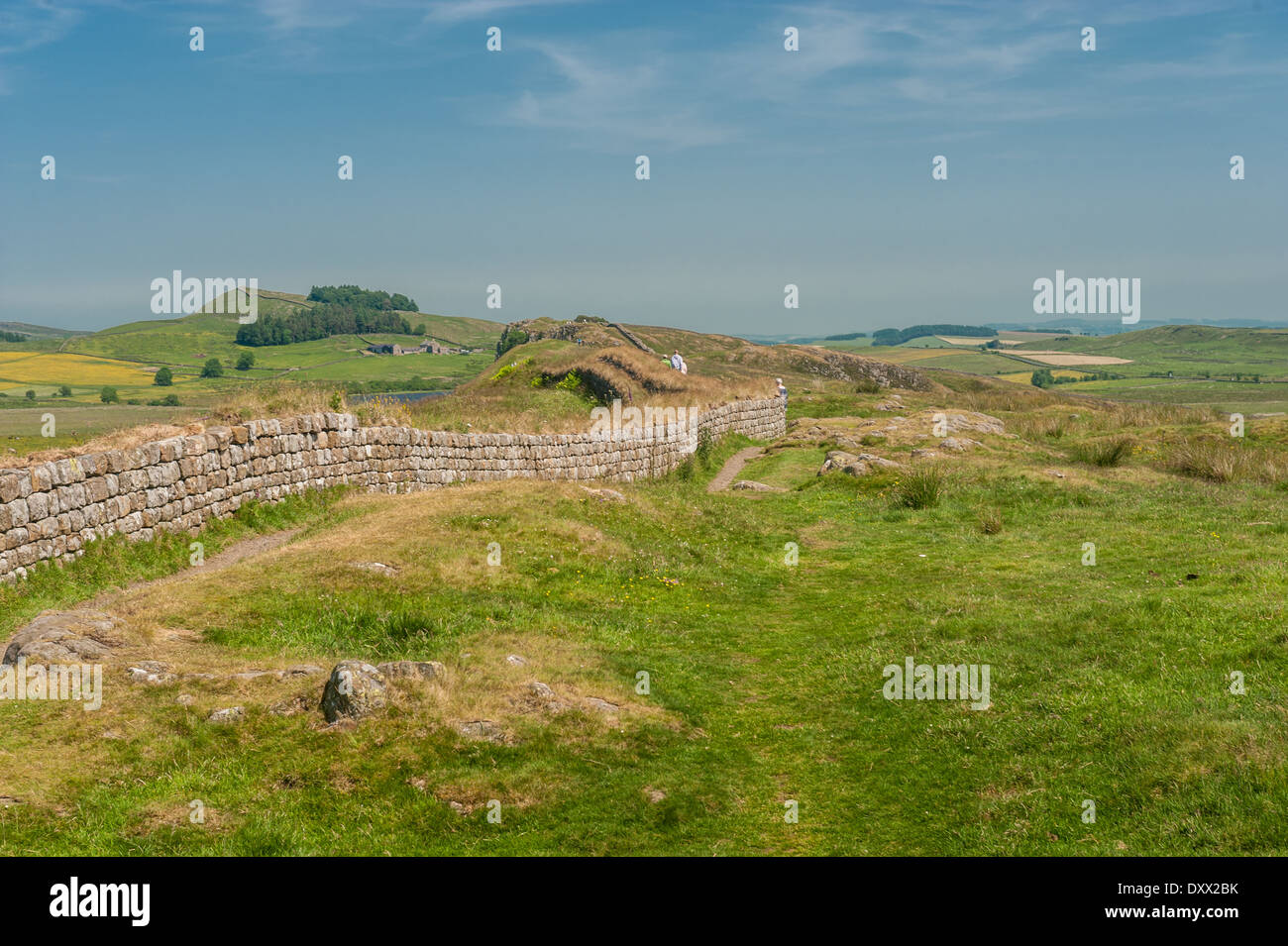 Group walking along Hadrians Wall in Northern England Stock Photo Alamy