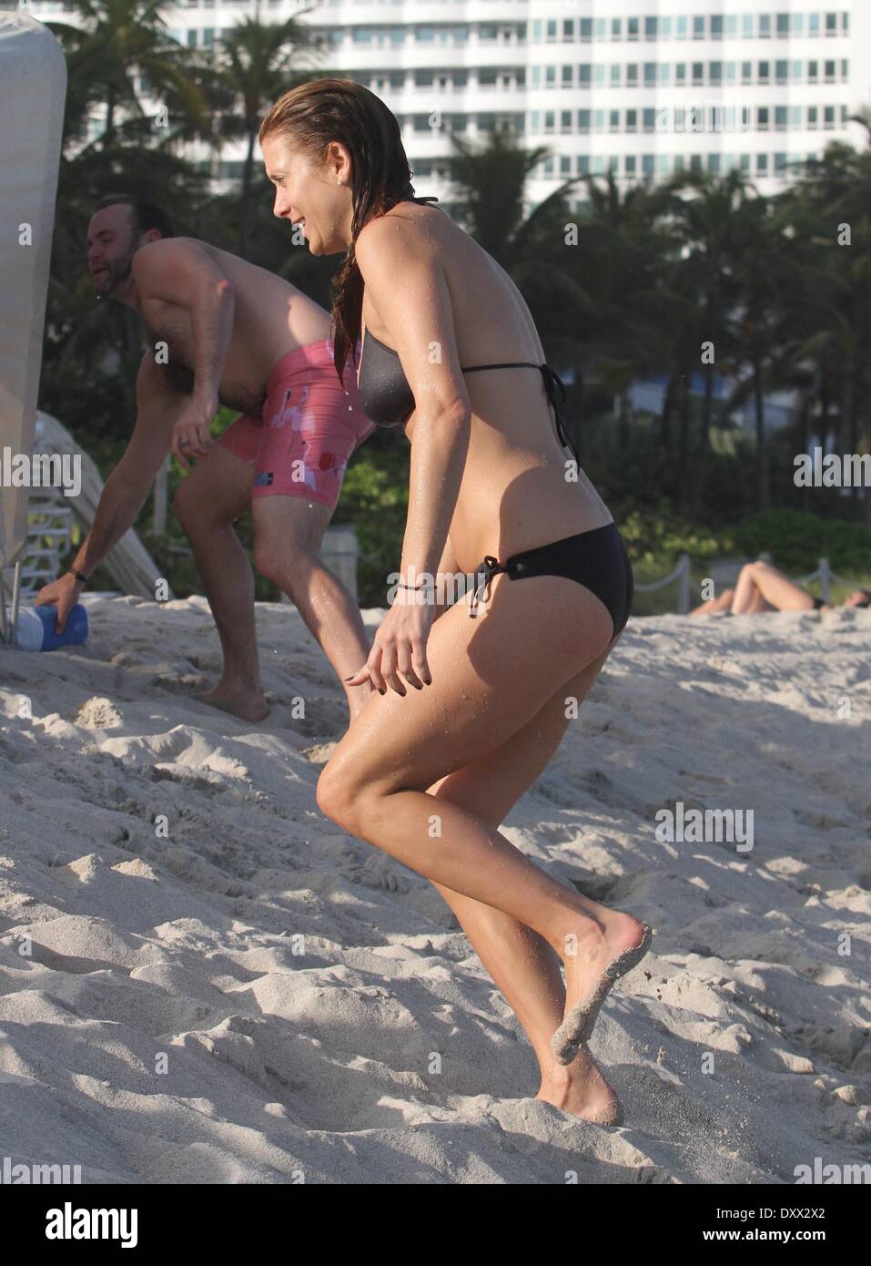 Kate Walsh shows off her bikini body as she spends the day on the beach.  The "Grey's Anatomy" actress spent time sunbathing before going for a swim  in the ocean. Miami Beach, -