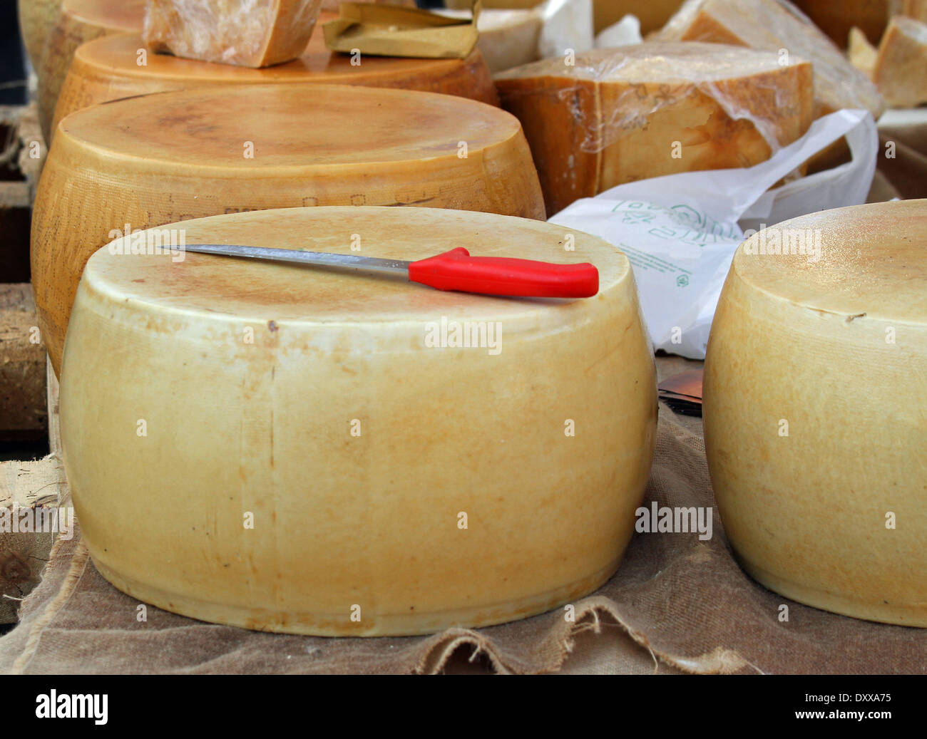 excellent yellow cheese on sale from milkman into a village fair Stock Photo