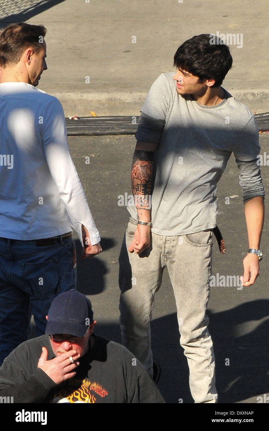 Zayn Malik shows off his new tattoos One Direction seen having lunch and  exchange gifts outside the CBS Studios before the taping of the 'X Factor'  finale. Los Angeles California- 20.12.12 Featuring:, image size:866x1390