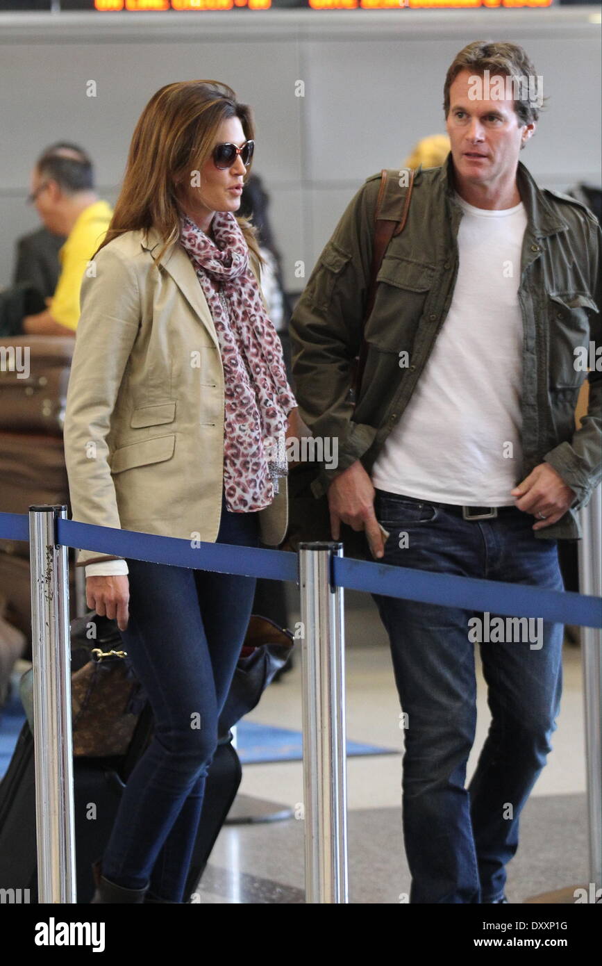 Cindy Crawford her husband Rande Gerber and their children Presley Walker and Kaia Jordan arrive at LAX International airport Los Angeles California- 21.12.12 Cindy Crawford,her husband Rande Gerber and their children