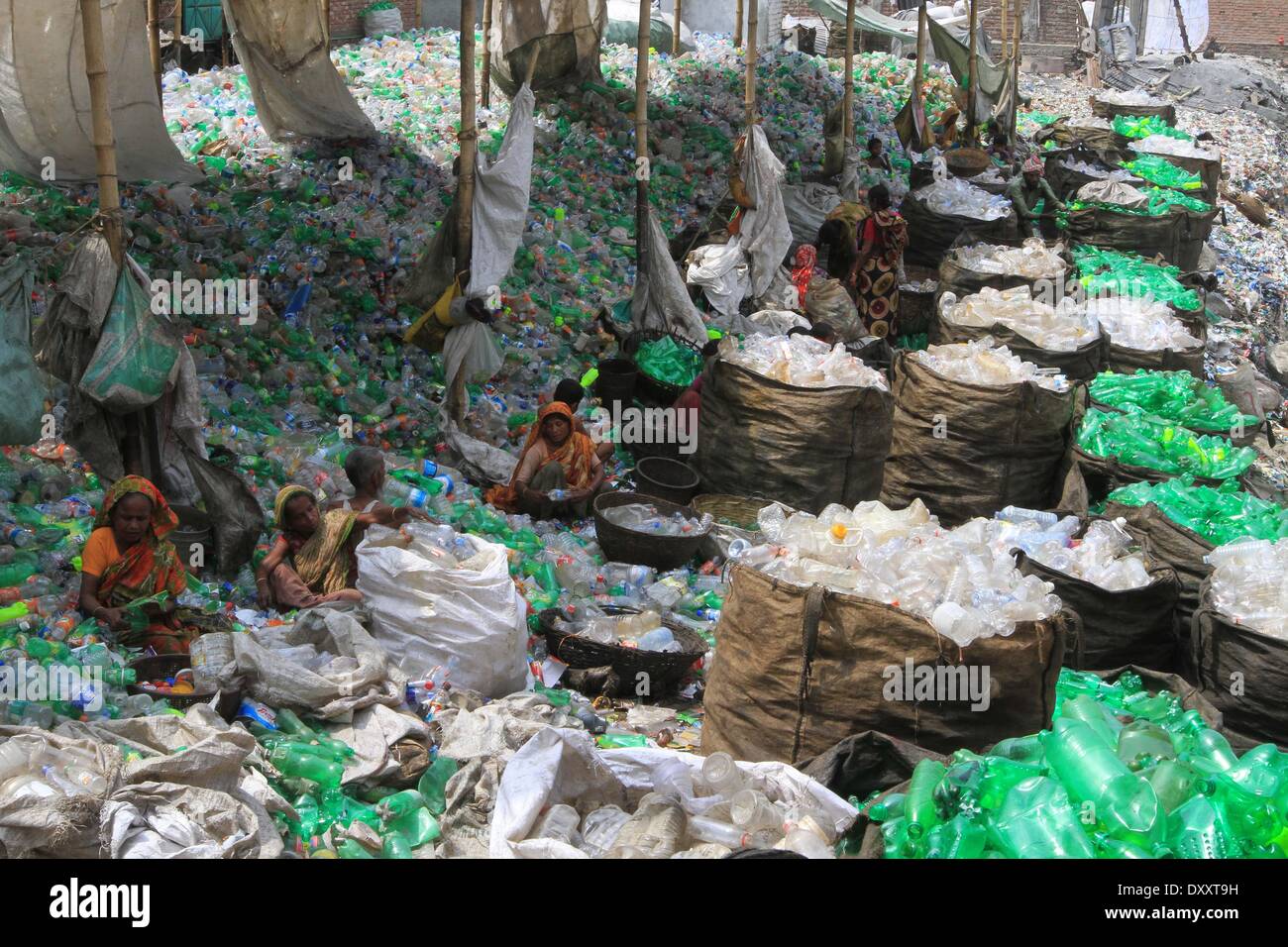 Bangladeshi people works in a plastic bottle recycling factory Stock