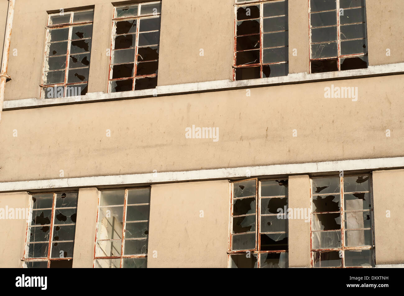 Broken windows of abandoned factory Stock Photo