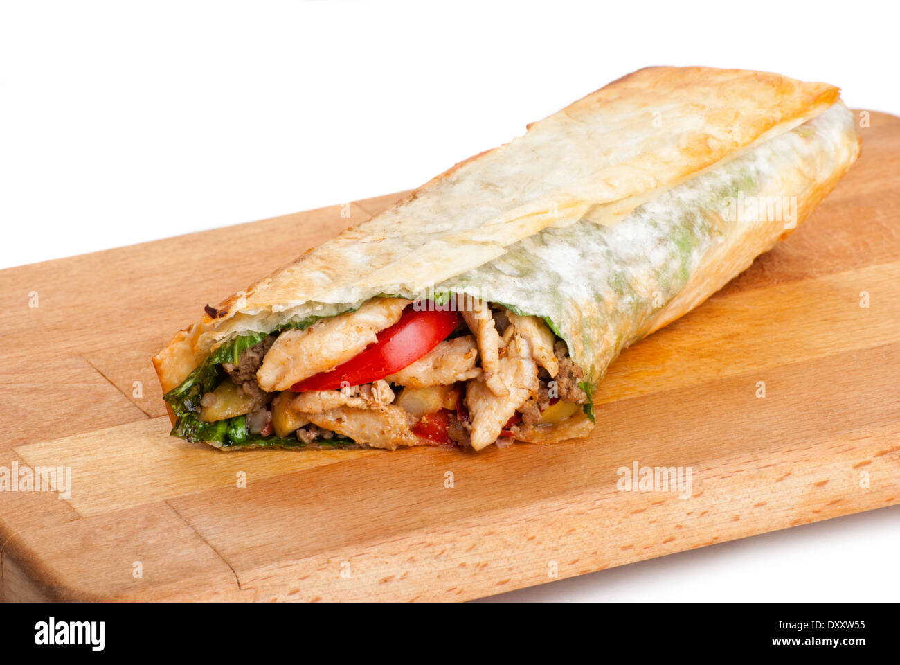 chicken burrito with fried potato and tomato on plate Stock Photo