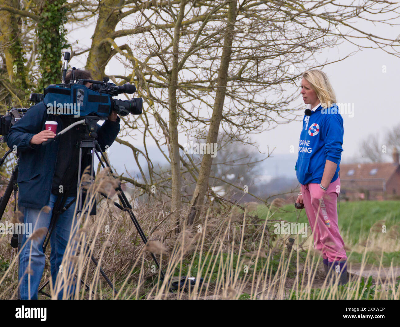 Burrowbridge, Somerset, UK. 31st March 2014. Work has commenced on the dredging of the River Parrett as part of a 20 year plan to alleviate the risk of flooding on the Somerset Levels. Bryony Sadler, a local resident affected by the flooding and a member of the Flooding on the Levels Action Group (FLAG)  is interviewed. Credit:  Mr Standfast/Alamy Live News Stock Photo