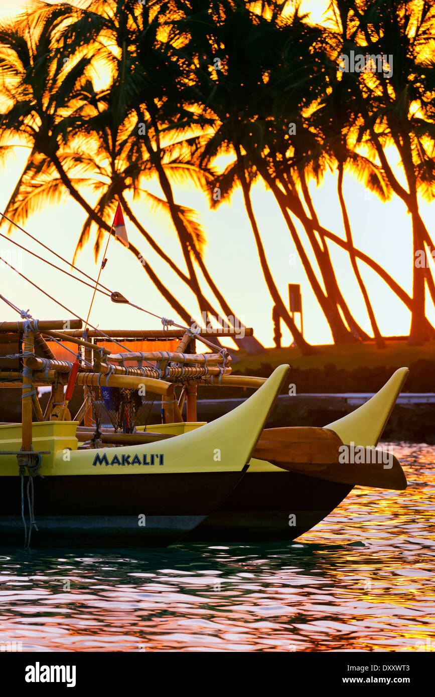 Makali'i double hull canoe at sunset, Keauhou Bay; Big Island, Hawaii, United States of America Stock Photo
