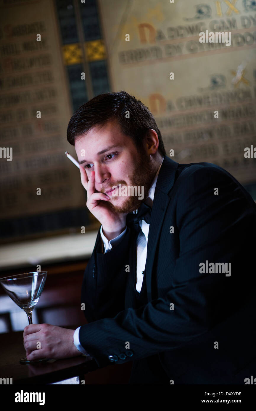 Young man men boy modeling for a 'Great Gatsby' themed makeover photo shoot, UK Stock Photo