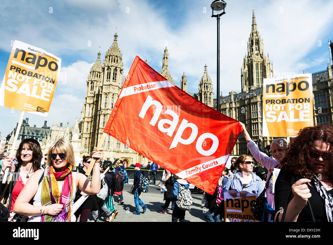 London, UK. 1st April 2014.  A NAPO banner is held aloft outside the Houses of Parliament as part of the joint demonstration by probation officers and legal aid solicitors. Photographer: Gordon Scammell/Alamy Live News Stock Photo