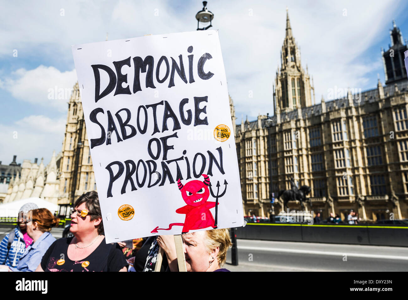 London, UK. 1st April 2014.  A hand written placard is held aloft outside the Houses of Parliament as part of the joint demonstration by probation officers and legal aid solicitors. Photographer: Gordon Scammell/Alamy Live News Stock Photo