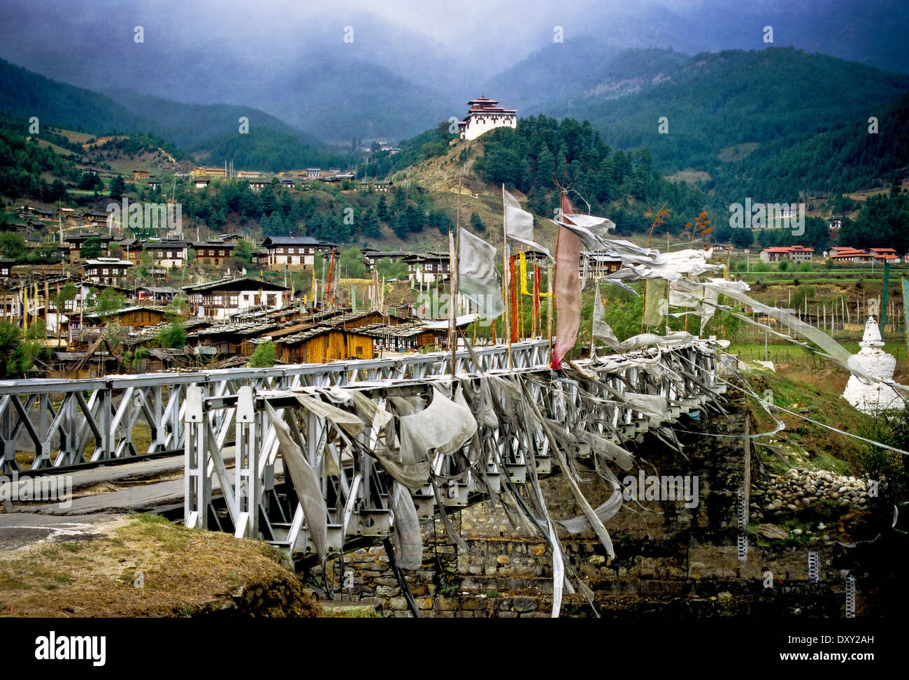 Road bridge in Jakar, Bhutan with prayer flags blowing in a strong wind Stock Photo