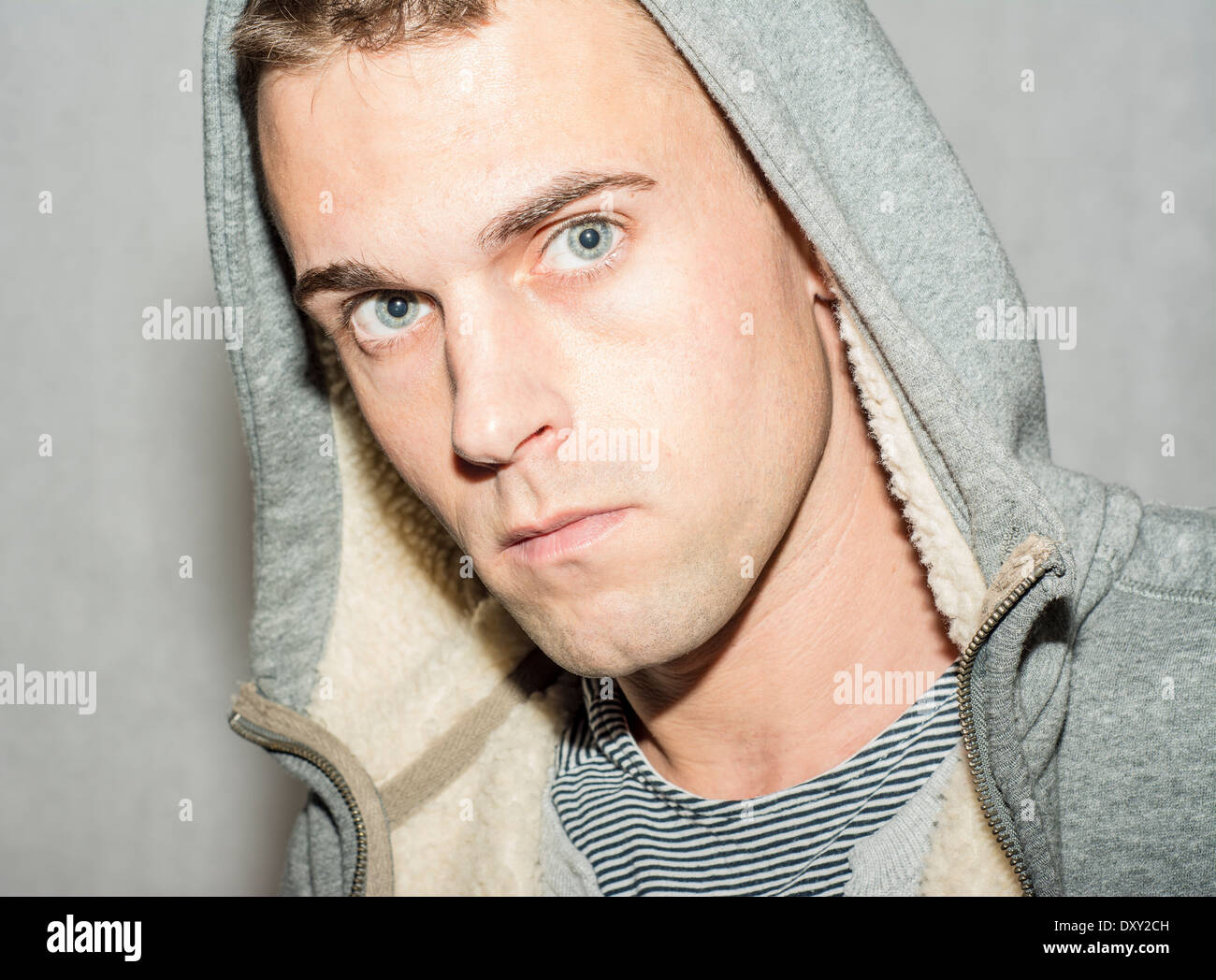 Moody male wearing hooded top Stock Photo