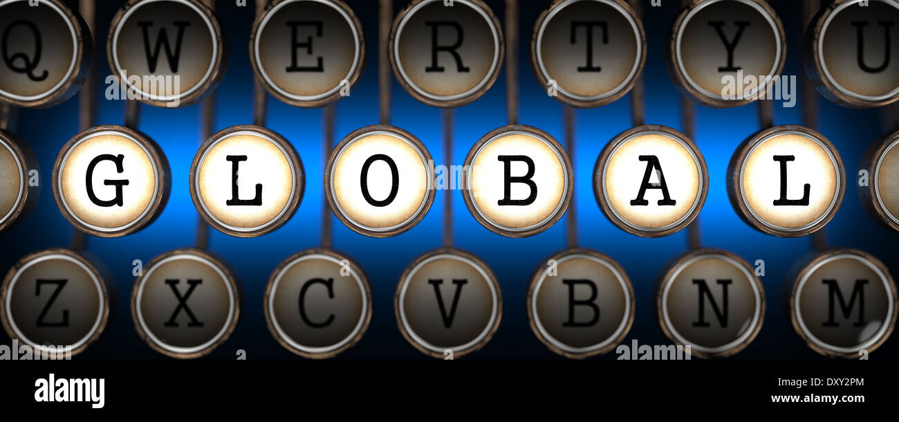 Global on Old Typewriter's Keys. Stock Photo