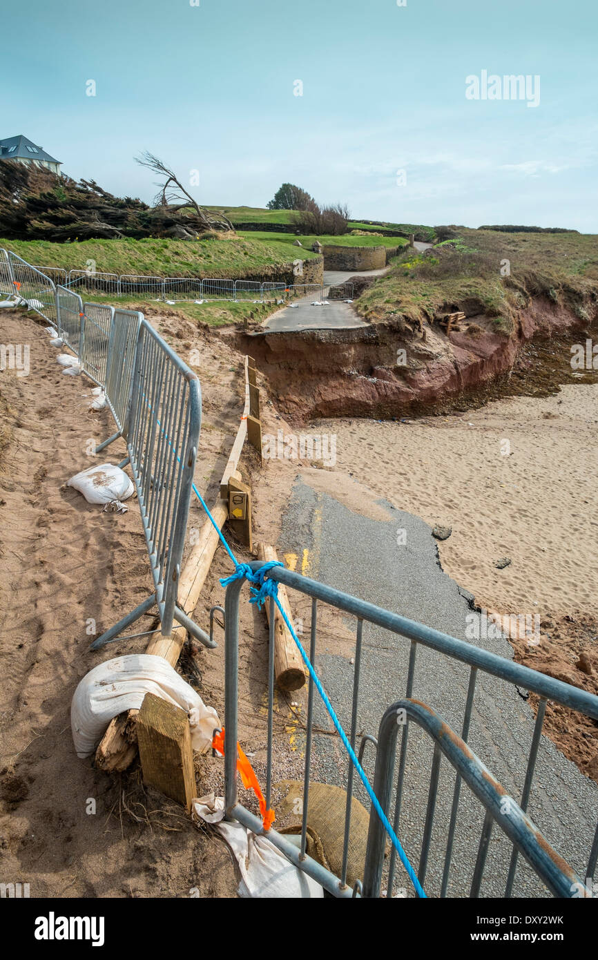 Winter coastal storm damage, road and sand dunes washed away. Thurlestone, Devon. UK Stock Photo