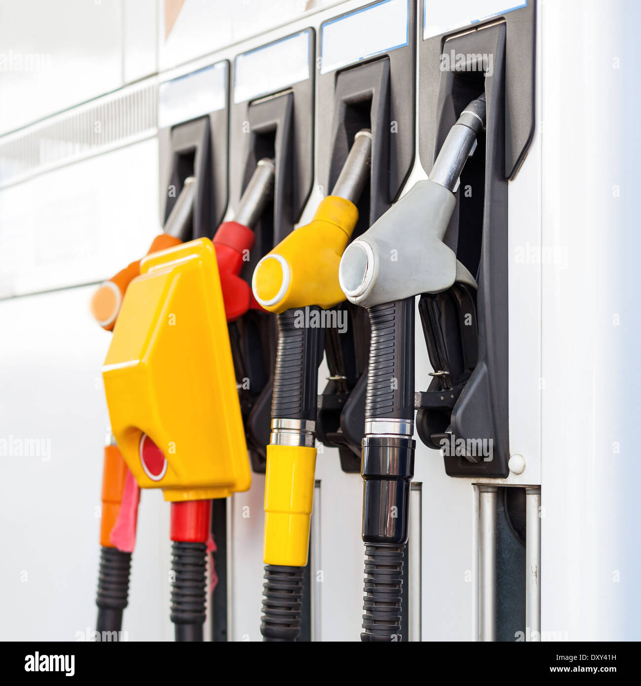 Pump nozzles at the gas station Stock Photo - Alamy